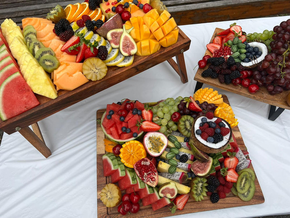 Premium fruit grazing boards with melon, berries and tropical fruit